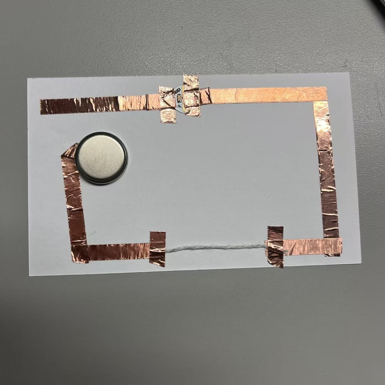 Use the wool to complete the circuit by energizing it.