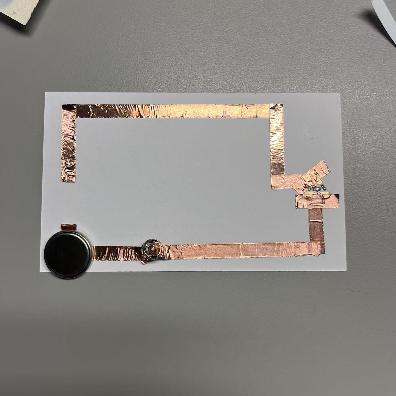 Circuits completed using metal buttons.