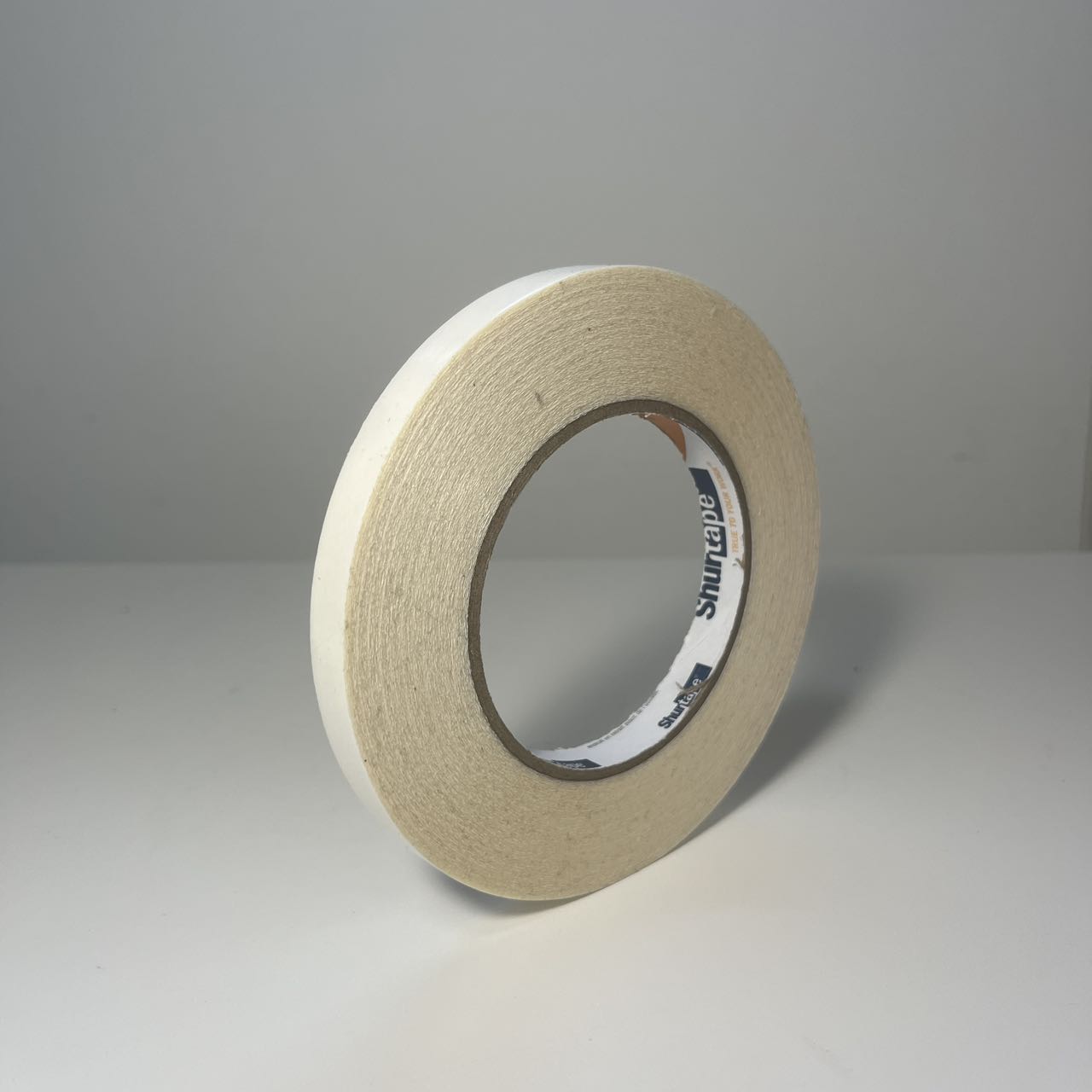 Double-sided tape standing on a table