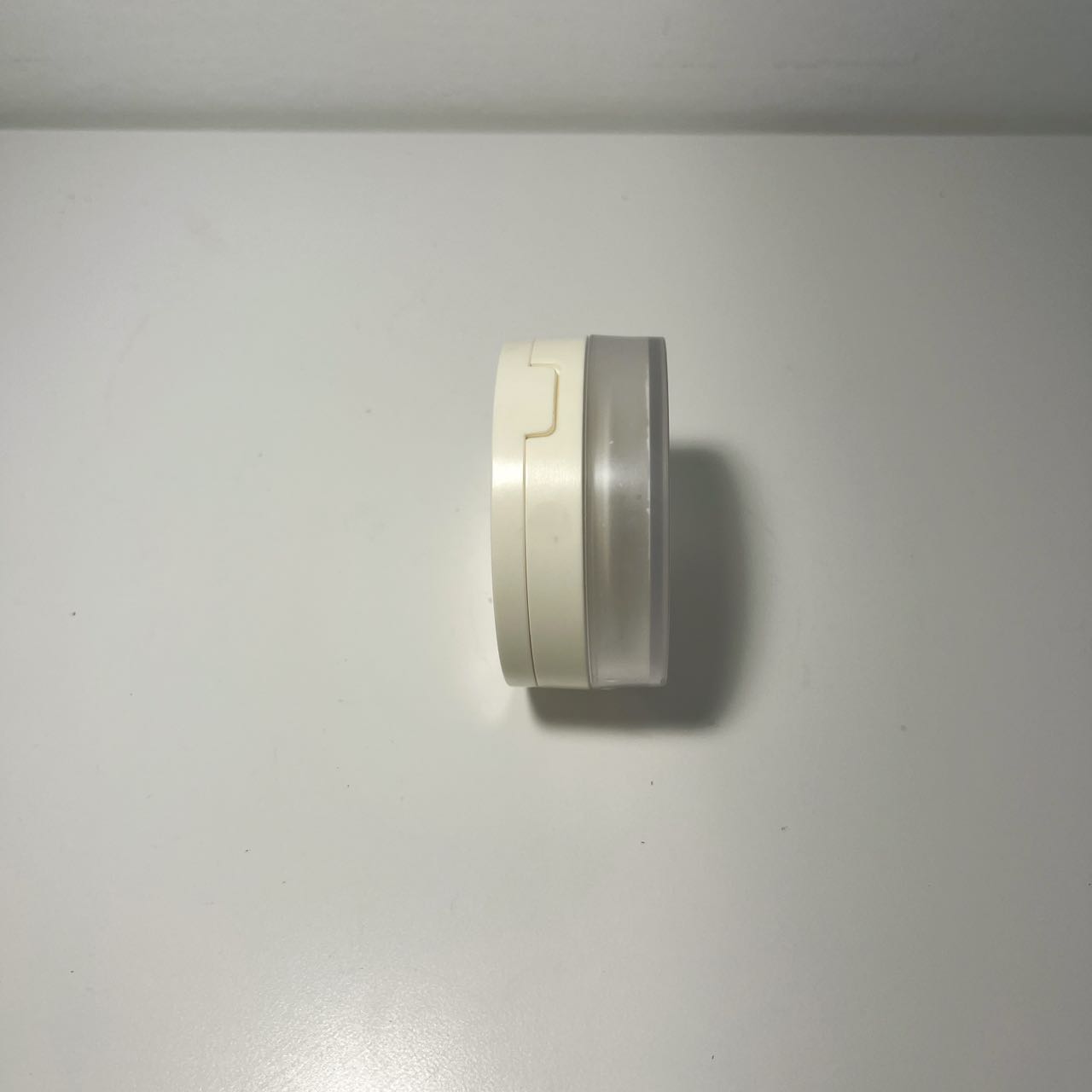 Side view of loose powder standing on a table